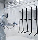 Paint surface coating being done by an industrial paint specialist.